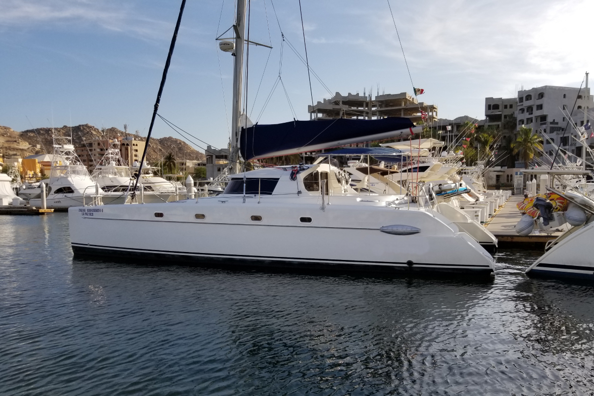 A sailing catamaran at its dock in the Cabo San Lucas marina