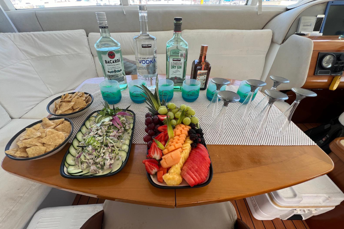 Fresh ceviche, fruit platter and open bar served onboard a Cabo catamaran