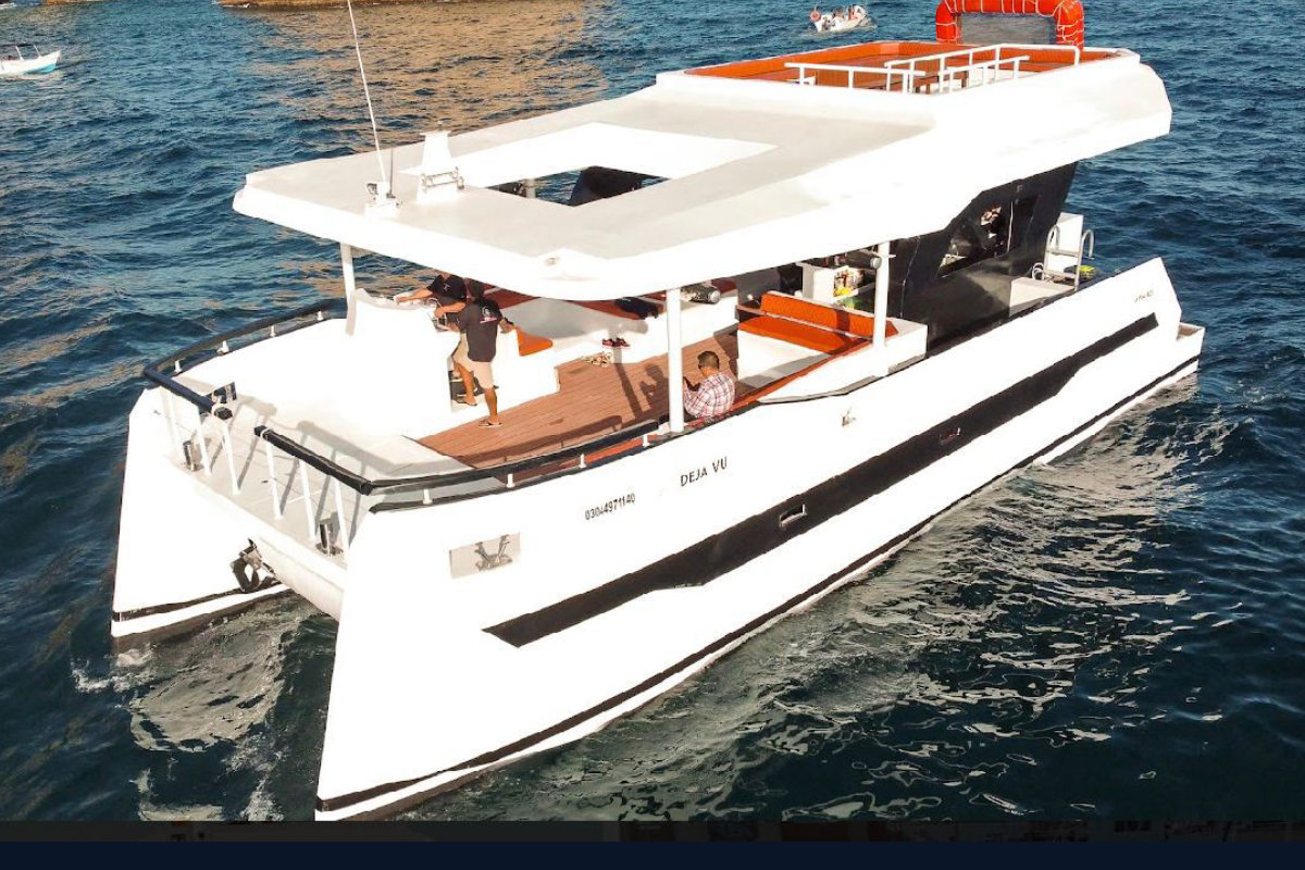 Aerial view of a two level event catamaran with open decks in Los Cabos