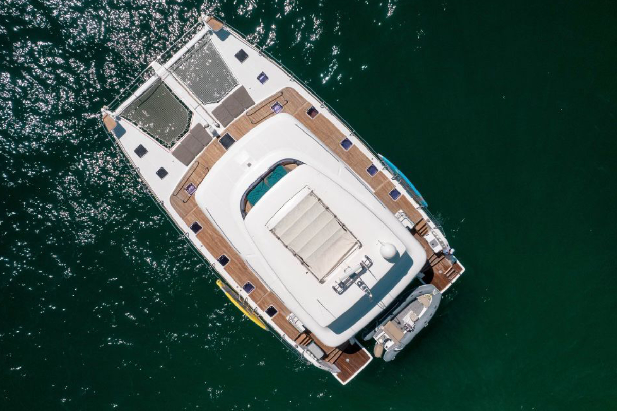 Aerial view of a private catamaran charter on the water in Los Cabos